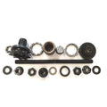 Assorted parts from the Academy Origin Bike 10mm FC Hub Kit—including ball bearings, nuts, washers, threaded axle, and gear components—are arranged neatly on a white background.