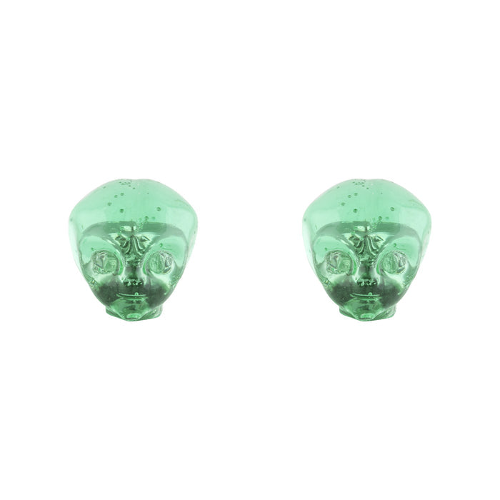 Two translucent green resin objects shaped like alien heads sit side by side on a white background, resembling Alienation Alien Valve Caps designed for Schrader valves.