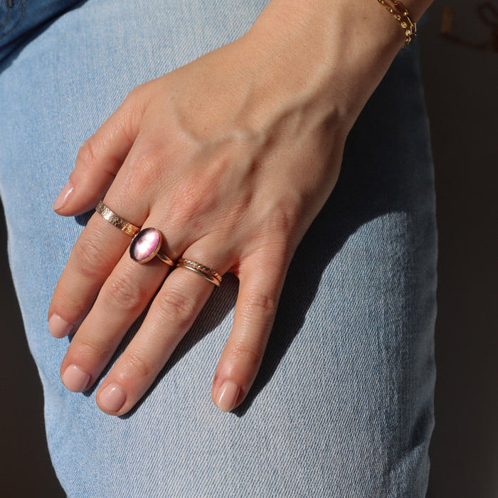 model wearing 14k gold fill rings with fluorite stone paired with a chain bracelet