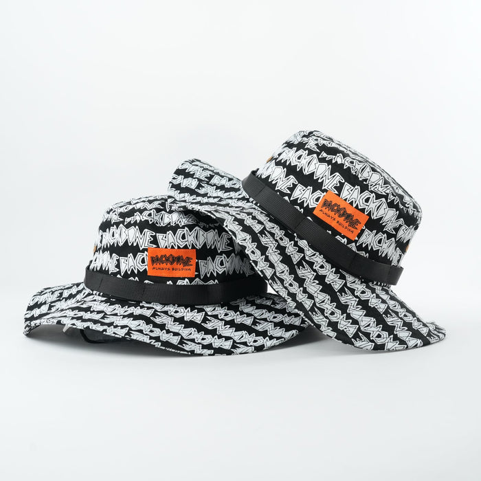 Two Backbone AO Boonie bucket hats featuring black-and-white patterns, repeated text design, and orange rectangular front patches, overlapped on a white background—a bold accessory from Backbone BMX.