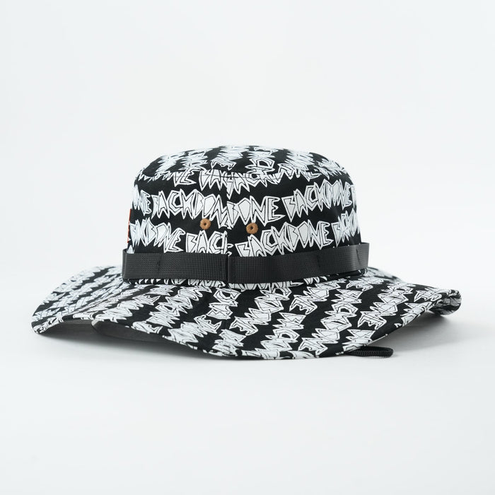 The Backbone AO Boonie is a black and white wide-brim hat with "BACK IN DA GAME" text pattern and metal eyelets on each side—ideal for expressing your Backbone BMX style.