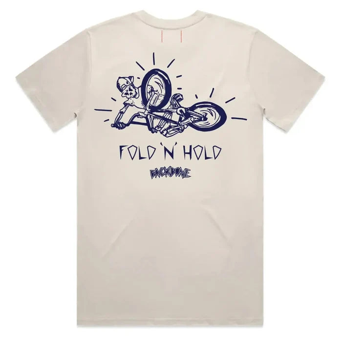 The Backbone Fold ‘n’ Hold T-Shirt is made from premium beige cotton and showcases a navy graphic of a person falling off a bicycle, with “FOLD N’ HOLD” and “RACONTEUR” text printed on the back—a playful nod to classic BMX t-shirt style from Backbone BMX.