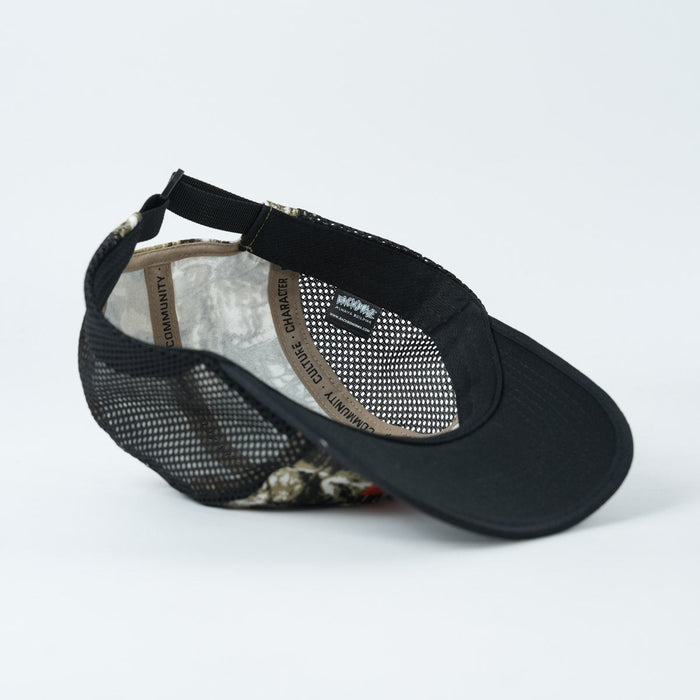A Backbone Ride Club Hat in black mesh is shown upside down on a plain white background, highlighting its adjustable strap and inner labels.