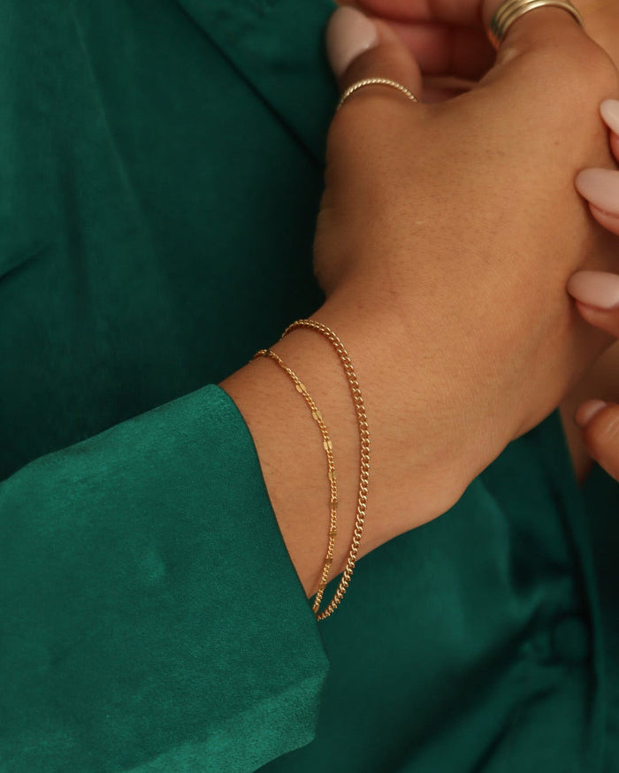 model wearing 14k gold fill bracelets