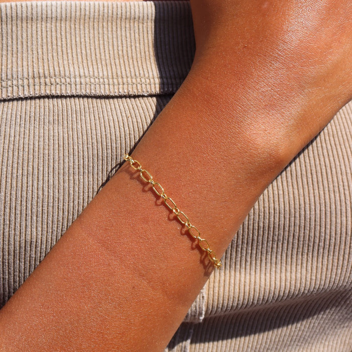 Model wearing 14k gold fill linked chain bracelet