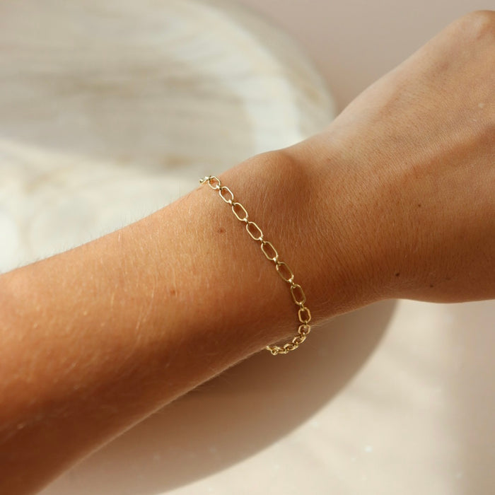 model wearing 14k gold fill chain bracelet