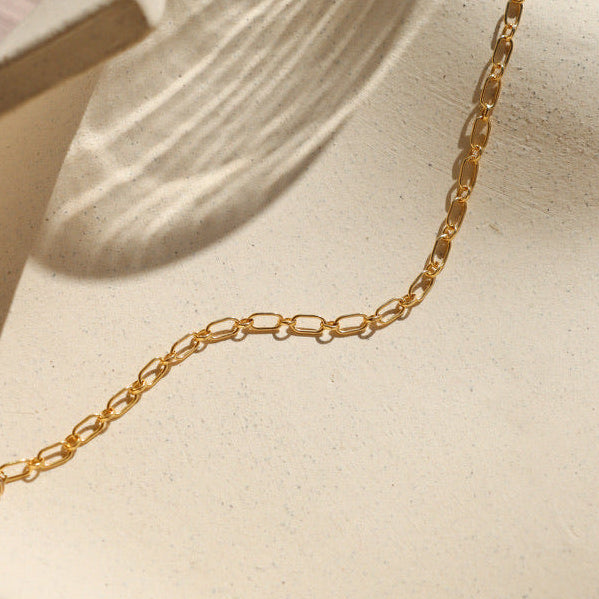 14k gold fill chain bracelet on a light dish