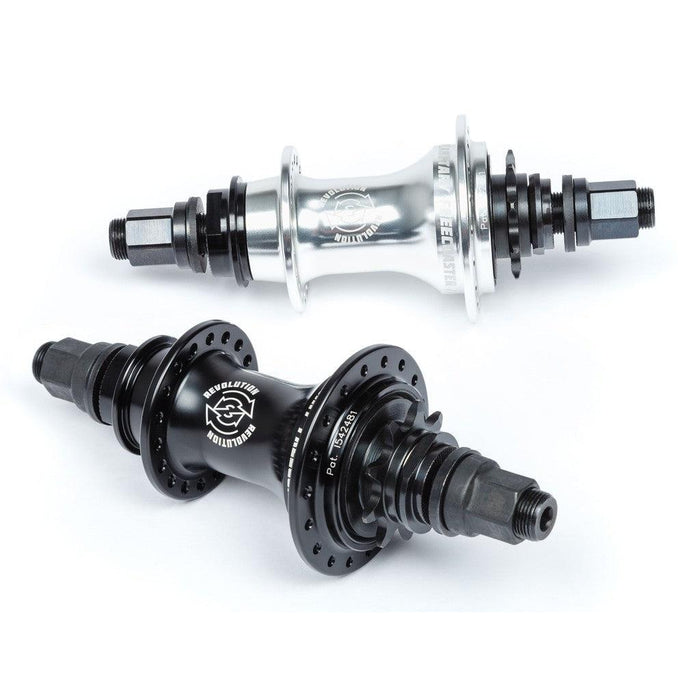 A silver and black BSD Revolution Rear Freecoaster Hub, featuring multiple holes and threaded axles, is displayed on a white background.