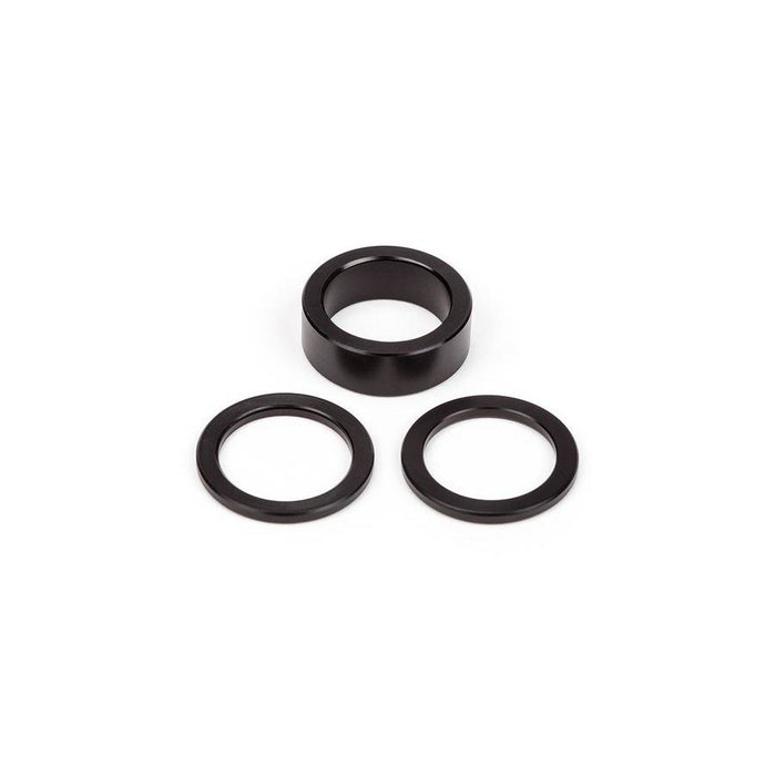 A set of black BSD West Coaster Gap Washers and rings on a white background, perfect for West Coaster Hubs and as a spare gap washer kit.