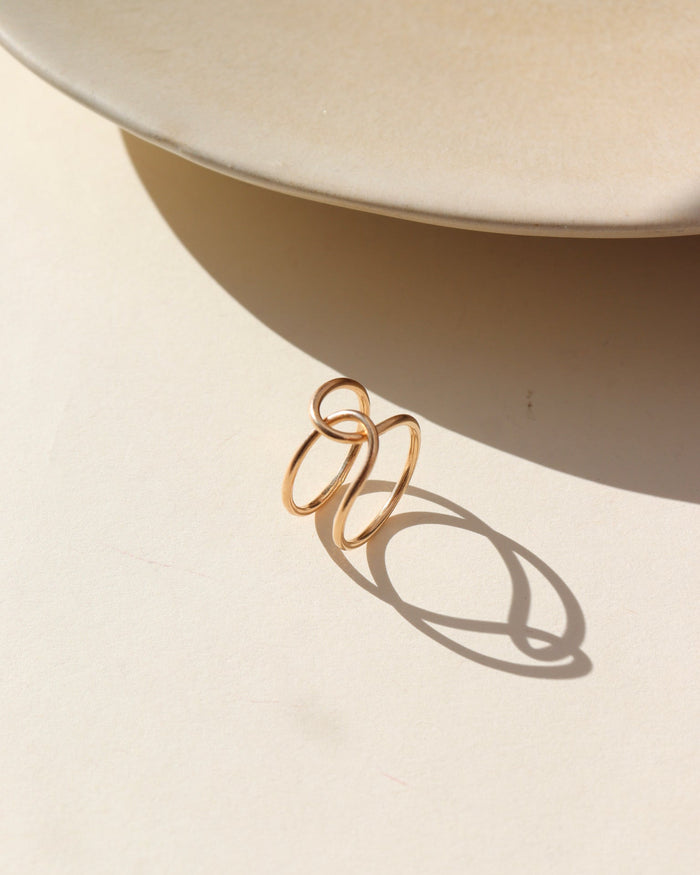 14k gold filled buckle ring in the sun.