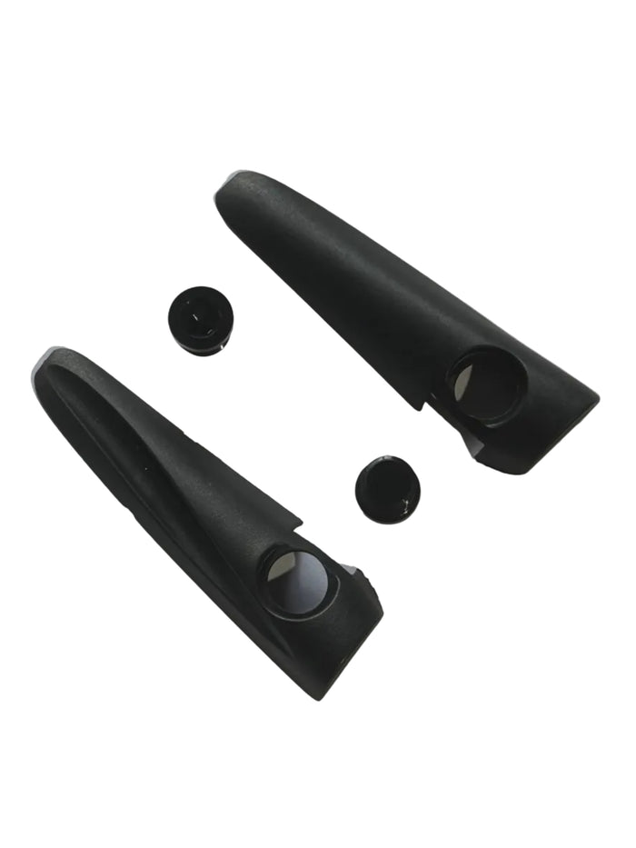 Two black plastic Chase ACT 1.2 V-Brake Mount Aero Covers with circular holes, accompanied by two round black caps and designed with durable nylon cleats, are displayed on a white background.
