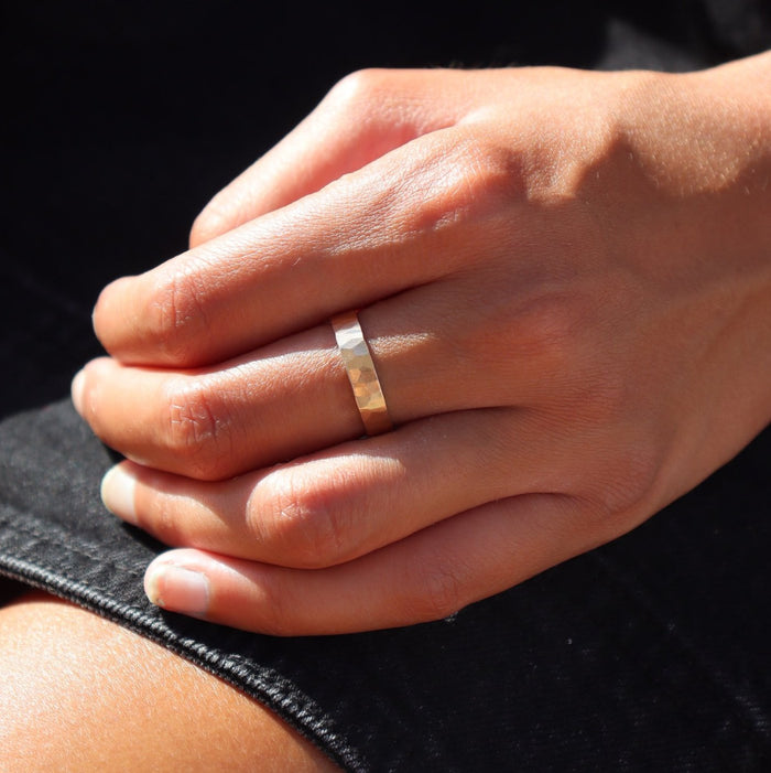 model wearing 14k gold fill hammered band ring
