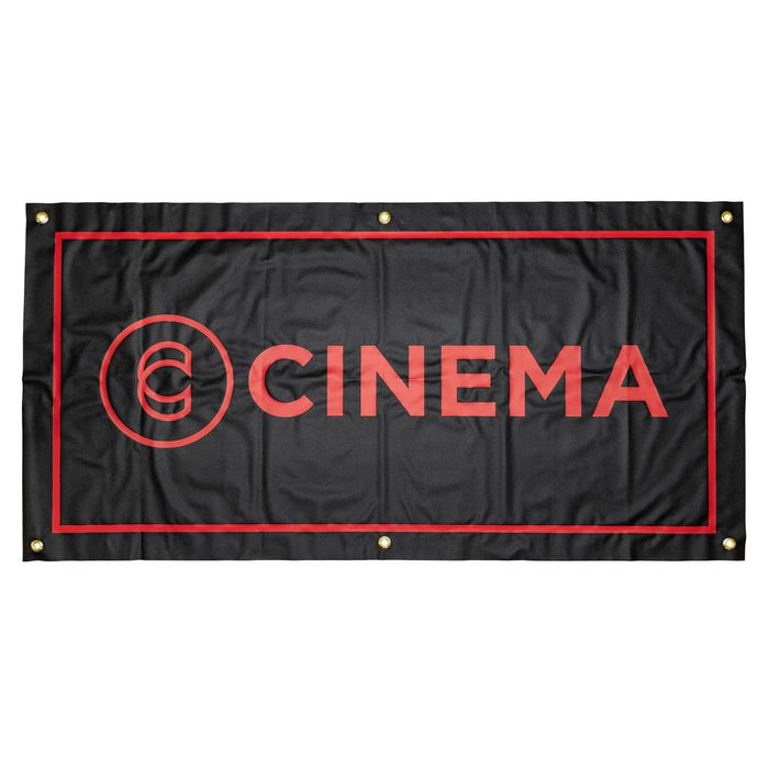 The Cinema Hanging Wall Banner features heavy-duty vinyl, a black background with red border, bold "CINEMA" lettering, and a circular logo on the left. Four metal grommets in the corners make it perfect for stylish room decor.