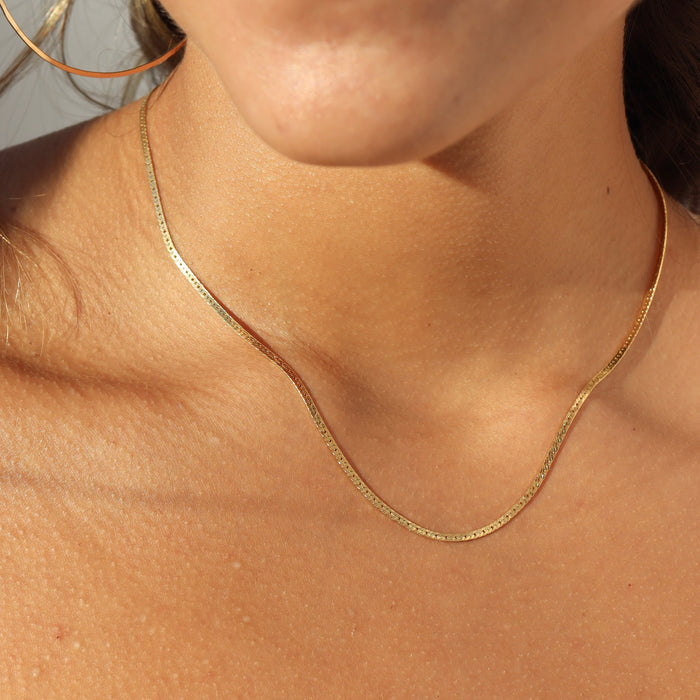 model wearing 14k gold fill herringbone chain necklace