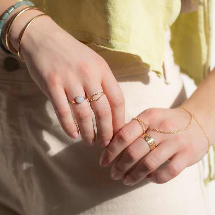 model wearing gemstone and 14k gold fill jewelry
