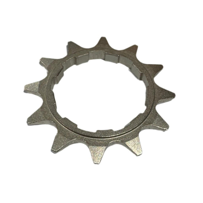 The CNC 1/2x1/8 HG Cassette Cog is a heat-treated chromoly cog with 11 teeth and a notched inner ring, compatible with 1/2x1/8 chains, shown on a white background.