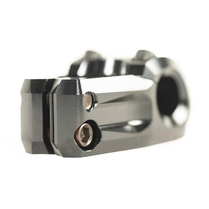 Close-up of a machined metal BMX stem part with visible bolts and a smooth black finish, isolated on a white background. This is the Colony Variant 35mm Stem (22.2mm Clamp), offering precise control and long-lasting durability.