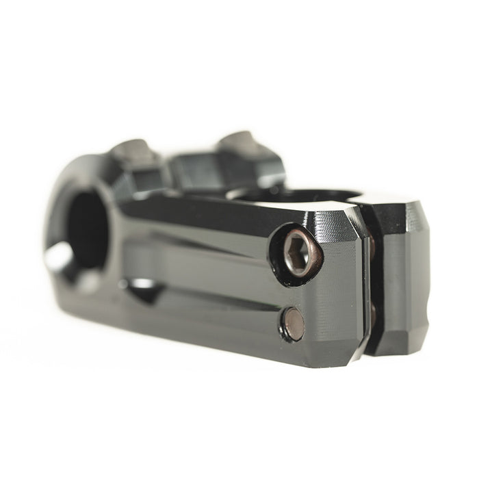 Black metal BMX stem with angular edges, viewed from a low angle on a white background—this is the sleek Colony Variant 52mm BMX Stem (22.2mm Clamp), designed as a low-rise stem for optimal control and style.