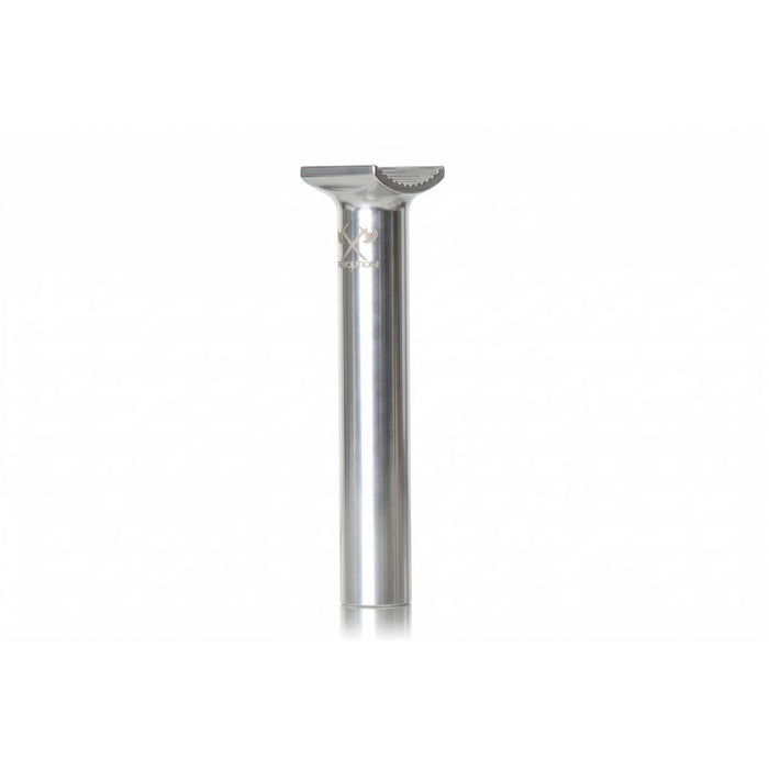 The Demolition Axes Pivotal Seat Post is a low-profile, silver metal bicycle seatpost made from forged alloy for durability, shown standing upright on a white background.