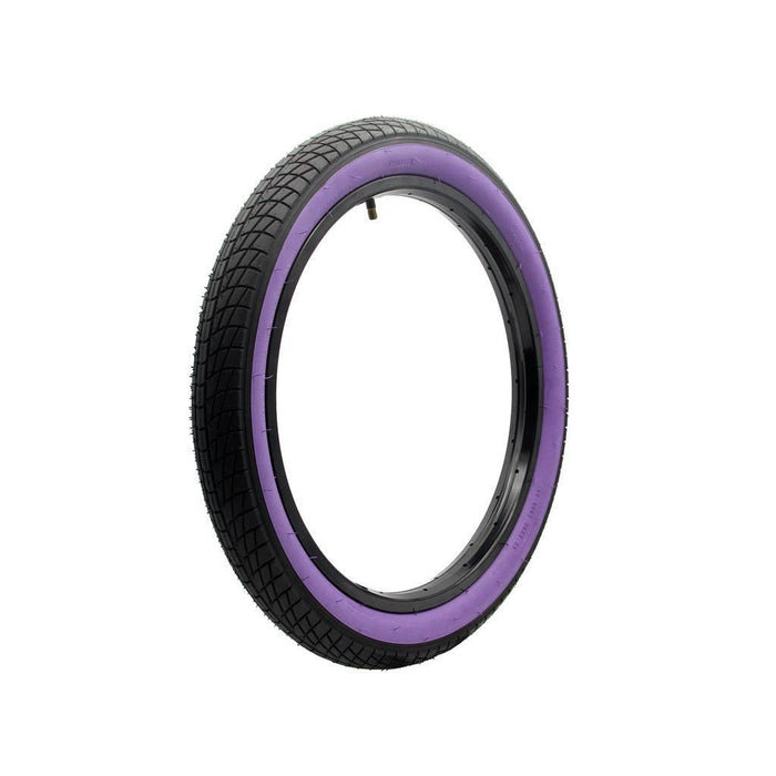 The DRS Gripper 20 Inch Tyre features a black tread with a purple sidewall, shown upright on a white background—an affordable choice for BMX riders seeking both style and performance.