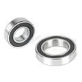 The ECLAT Cortex CS Hub Bearing Set, featuring two metal bearings with black inner seals, is displayed on a white background—one flat and one standing on its edge.