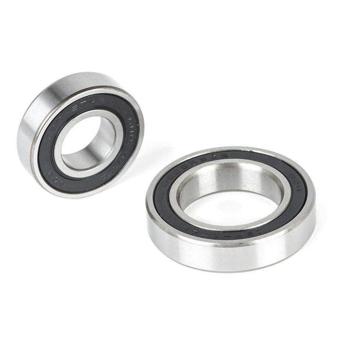 The ECLAT Cortex CS Hub Bearing Set, featuring two metal bearings with black inner seals, is displayed on a white background—one flat and one standing on its edge.