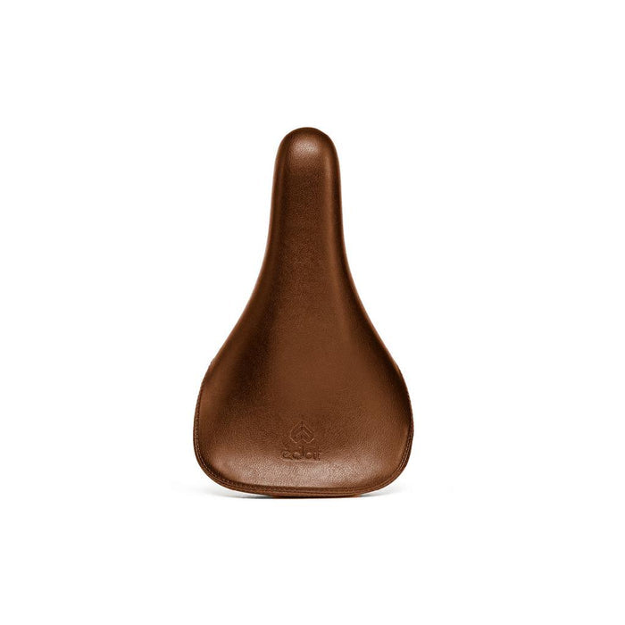 The Eclat Exile Railed Seat is a brown leather ergonomic bike seat with a tapered design, smooth surface, small embossed front logo, and strong hollow CrMo rails, viewed from above.