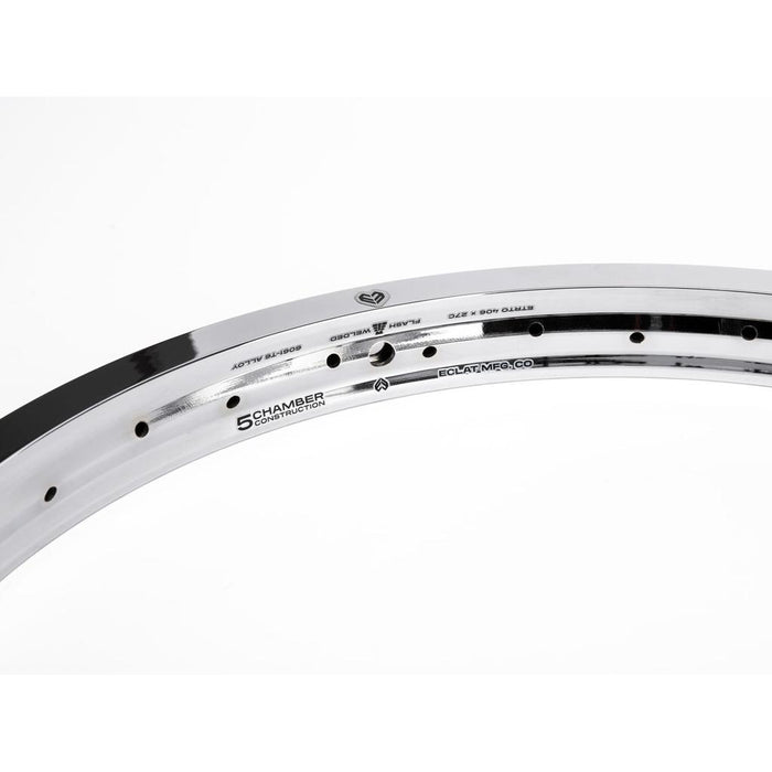 Close-up of the Eclat Temple 20 Inch Rim, a silver lightweight double-wall bike rim, set against a white background and showcasing its detailed engravings and construction.