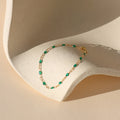 14k gold fill chain alternating with with transparent emerald gemstones bracelet