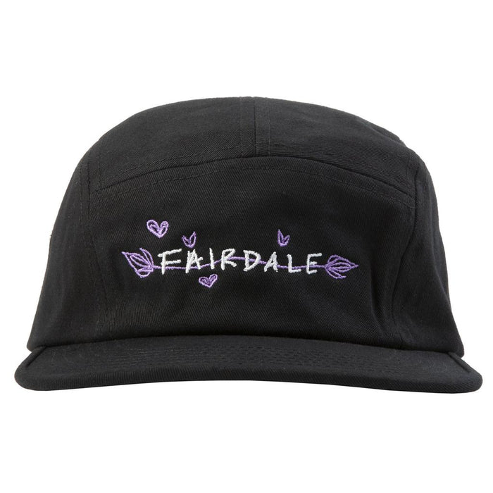 The Fairdale Nora V Camper Cap is a black five-panel hat featuring custom Nora bike-inspired artwork with "FAIRDALE" embroidered in white and purple, surrounded by small purple hearts and leaves.