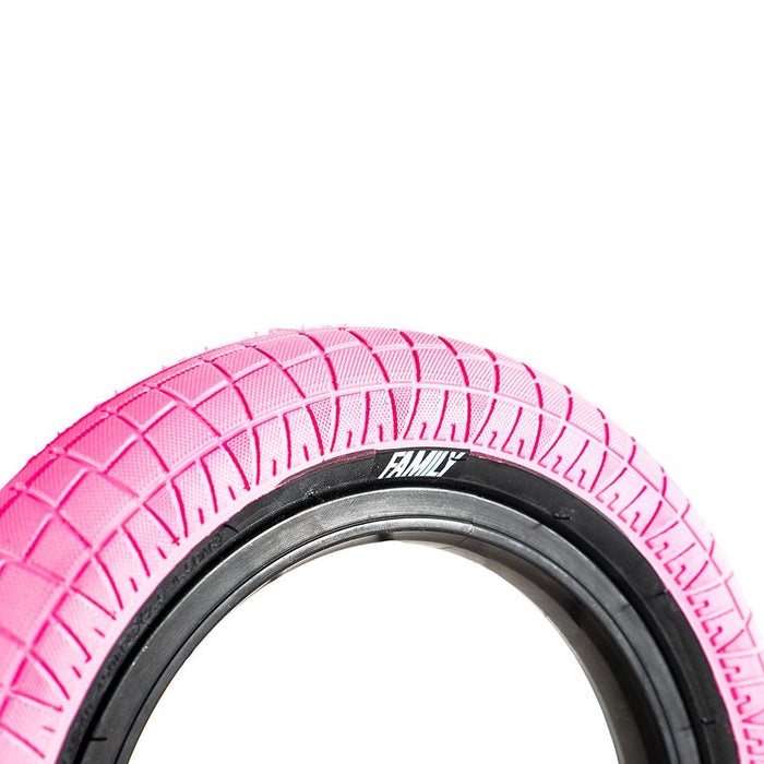 A pink Family BMX F2128 12 Inch Tyre on a white background.