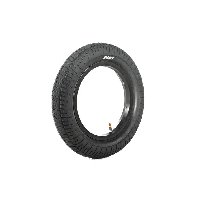 The Family F641 12 Inch Tyre, made of black rubber with a knurled tread and visible air valve, stands upright on a white background.