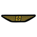 The Fit Bike Co Wings Embroidered Patch is a black patch with gold wings and a central star, featuring a satin border and heat seal backing—perfect as an aviation or pilot insignia.