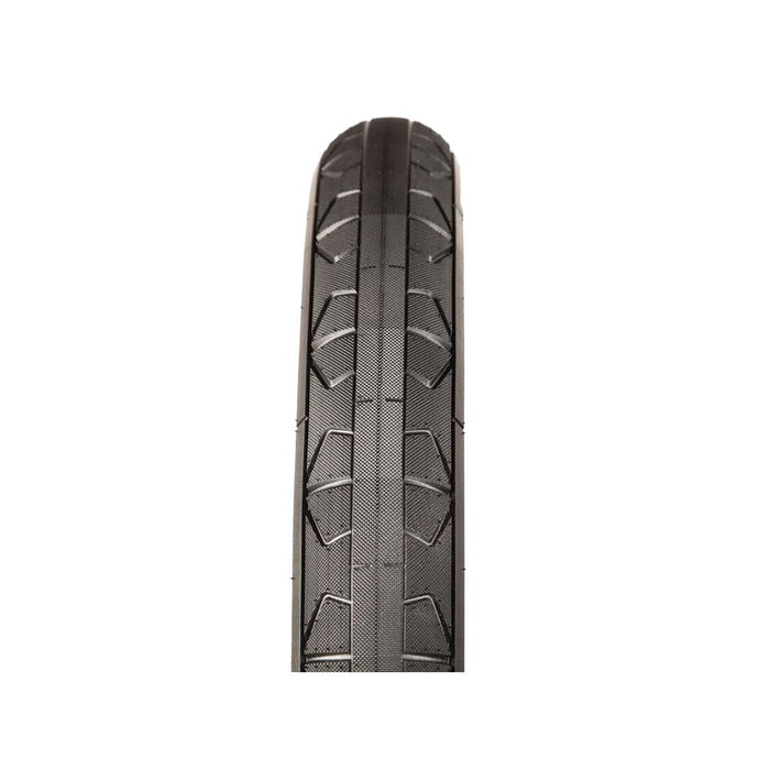 A top-down view of the FITBIKECO F/U 20 Inch Tyre in black highlights its tread pattern against a white background. Engineered to resist pinch flats, this tire provides enhanced durability for aggressive BMX riding.