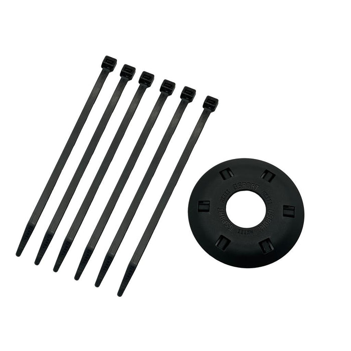 Six black cable ties are lined up next to a round black plastic G-Sport Gland MKIII NOS Front Hub Guard, featuring slots for the ties.