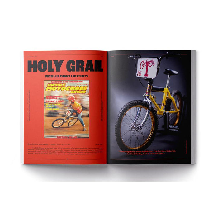 An open Greystoke Magazine V2 shows a vintage BMX bike on the right page and a bold "HOLY GRAIL" heading with the Greystoke cover and text on the left, capturing true BMX passion.