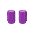 The Hexagon Valve Caps (Pair) boast a vibrant purple color and sleek metallic finish, adding style to every ride.