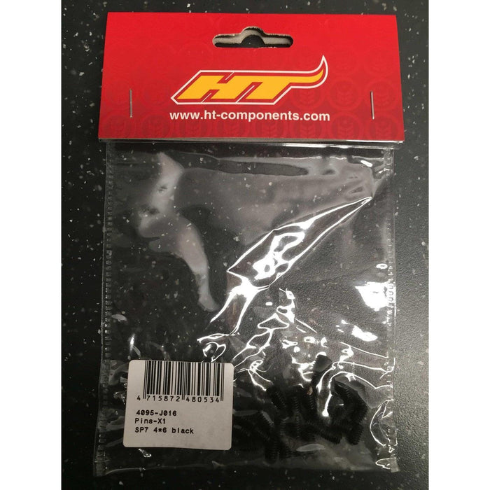 A plastic bag labeled "HT Components Pedal Pins - X1, X2, T1, D2" contains several black pedal pins with product code 4095-J016 (SP7 4x6), featuring a barcode and product label on the front.