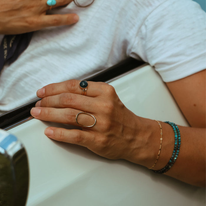 model wearing sterling silver rings with apatite stone