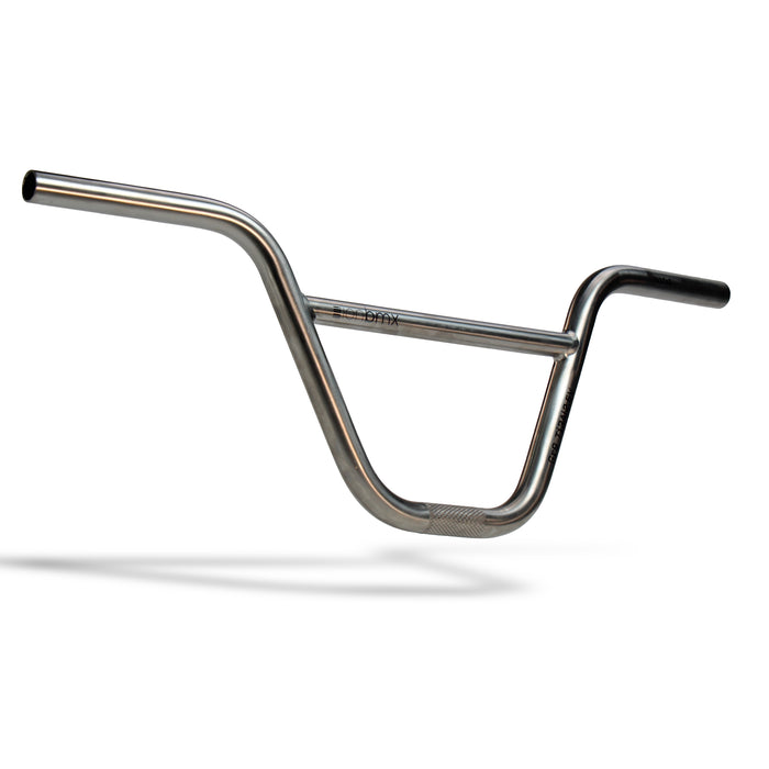 ION BMX Titanium Bars (22.2mm Clamp) with a crossbar and knurled grip area, photographed on a white background with a shadow below. Inspired by the ultralight BMX bars from ION BMX, these titanium handlebars blend classic style with advanced modern performance improvements.