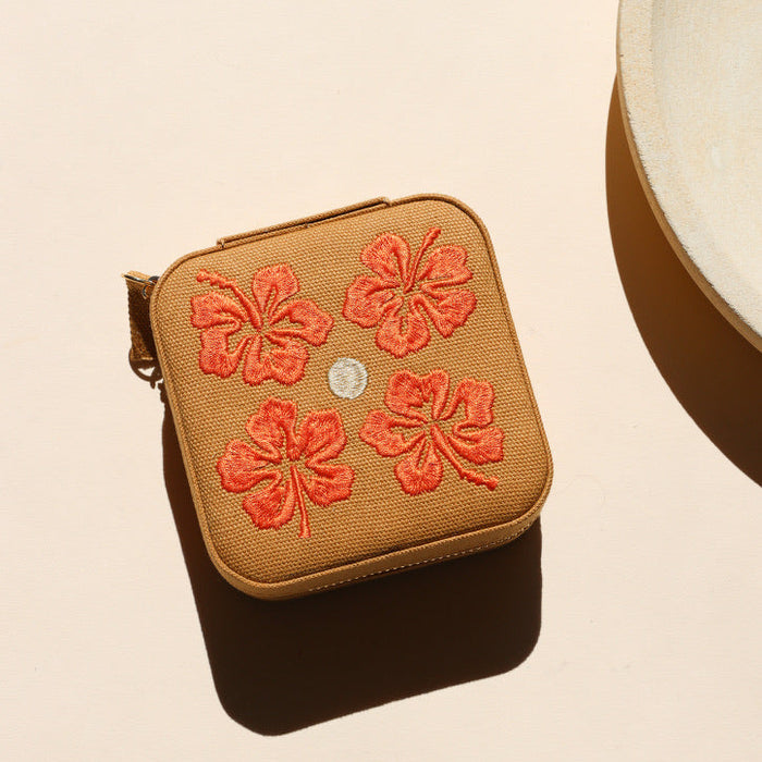 square travel jewelry case on a light background