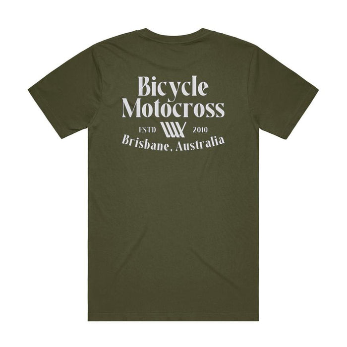 The LUXBMX Bicycle Motocross Tee Army is an olive green t-shirt featuring bold white text on the back that reads "Bicycle Motocross, ESTD 2010, Brisbane, Australia." This tee blends classic style with authentic BMX heritage.