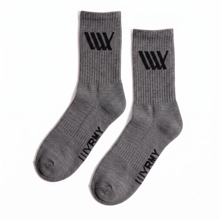A pair of LUXBMX Crew Socks in gray, made from a sturdy bamboo blend, showcasing black "W" logos by the cuffs and "W ARMY" text near the toes, set against a white background.