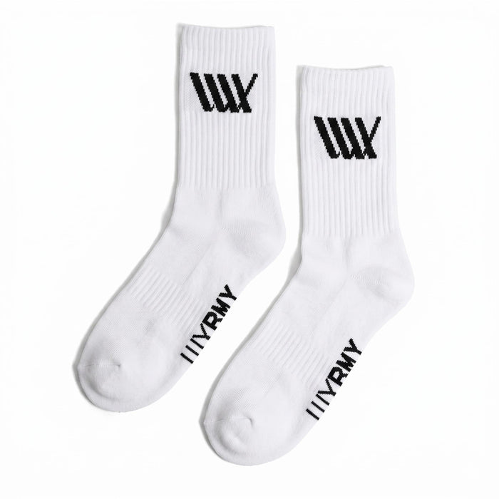 The LUXBMX Crew Socks (4 Pack Mix) feature white, durable crew socks with bold black graphic logos near the top and "WRNY" written on the foot area, offering both comfort and style for everyday wear.