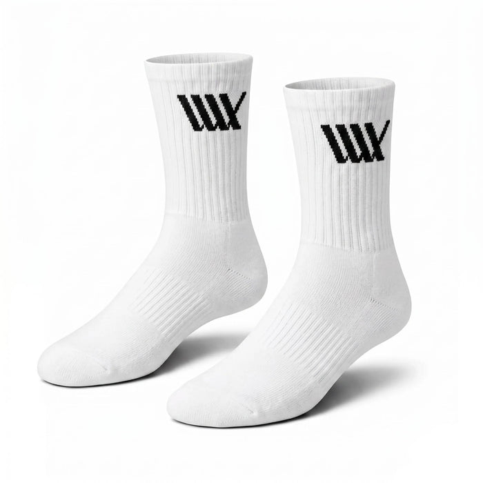 LUXBMX Crew Socks made from a durable bamboo blend, featuring a black geometric logo on the upper side of each white sock, shown against a plain white background.