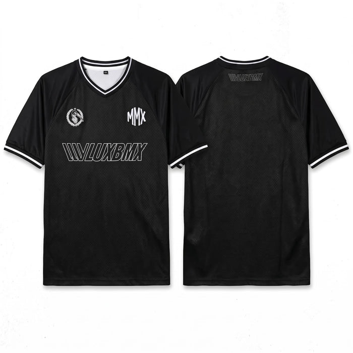 Front and back view of the LUXBMX MMX Soccer Jersey - Plain Back Print in black with white trim and logos "MMX," "LUXBMX," and a circular emblem. Pre-order this exclusive breathable BMX jersey now!.