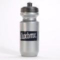 The LUXBMX Squirt Water Bottle 500ml in silver is made from BPA-free plastic, features a black screw-on lid and "Kluxbmx" text on the front, and stands upright on a white background.