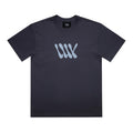 The LUXBMX Times Neue Tee Ink Blue is a black short-sleeve t-shirt crafted from heavyweight cotton, featuring a light blue abstract “WW” logo on the chest and shown laid flat on a white background—an ideal choice for fans of Bicycle Motocross style.