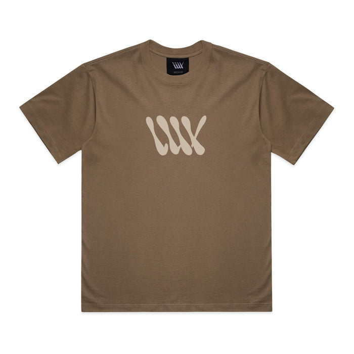 Introducing the LUXBMX Times Neue Tee Walnut—a heavyweight cotton t-shirt in rich walnut brown, featuring a beige abstract "WW" design on the chest and a matching logo tag inside the collar. This tee merges comfort and style, making it an essential addition to any BMX shirt collection.