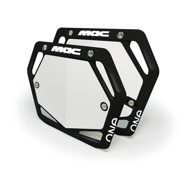 Two black and white Mac Components Pro Plate metal license plate frames with “MAC” and “ONE” text, stacked with slight overlap—ideal for BMX fans or anyone who loves top Aussie brand style.